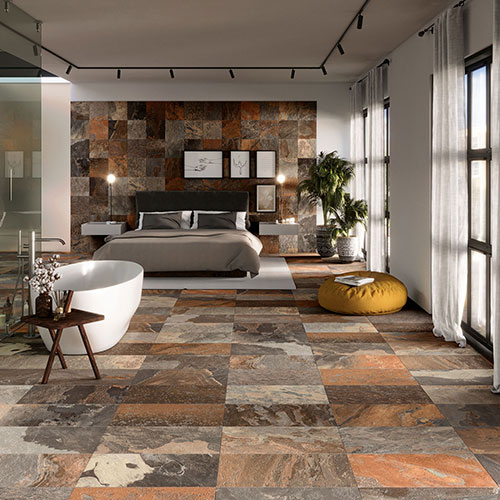 Ambiente camera realizzato con Pavimento e rivetimento della collezione More, variante Sunset