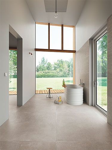 Pambiente bagno realizzato con pavimento e rivestimento della collezione Stones, variante Grey